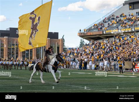 The University of Wyoming holds an opening ceremony for a football game ...