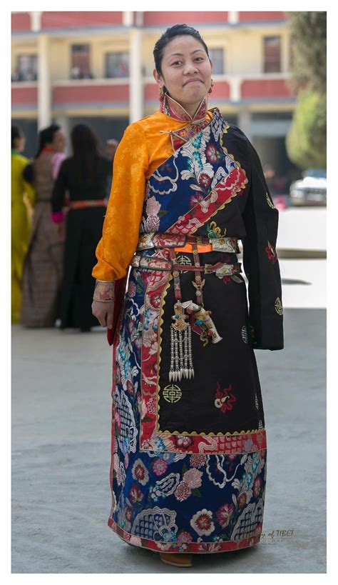 A Tibetan women wearing khampa chupa with some tradition accessories ...