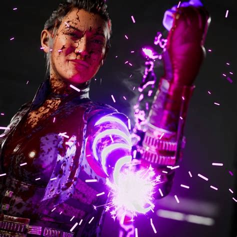 a man holding a lit up purple object in his right hand and fireworks ...