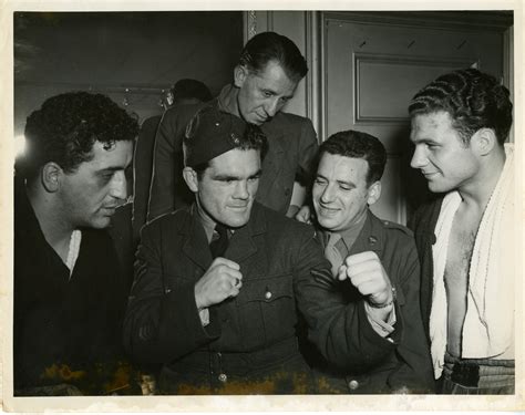 American boxers meet a British boxer serving in the Royal Air Forces in England on 22 June 1944 ...