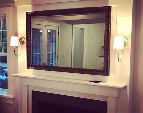 📺 Two-way mirror covering a flatscreen TV and custom framed in ...