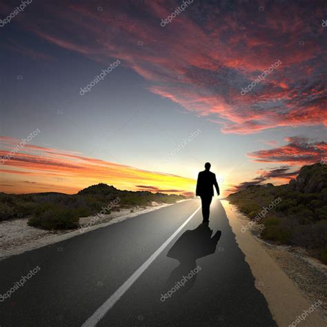 Man walking away at dawn along road — Stock Photo © SergeyNivens #8395344