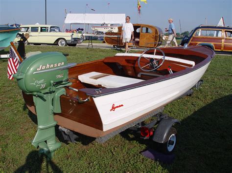 Old Johnson motor on an old wooden boat. Gotta have this set-up ...