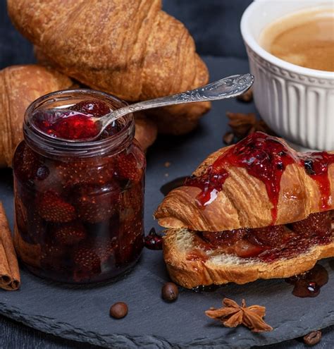 Premium Photo | Baked croissant with strawberry jam