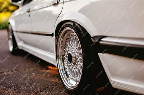 Premium Photo | Classic shiny retro wheels on white car.