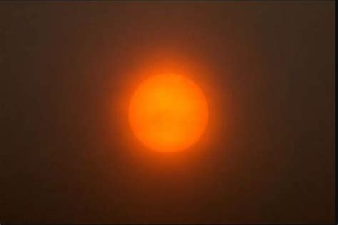 IN PICTURES: Sun gives an orange glow in the sky over Nottingham ...