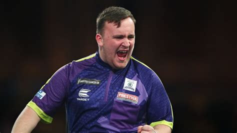 World Darts Championship: Teenager Luke Littler defeats Andrew Gilding to continue dream run at ...