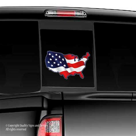 an american flag decal on the back of a truck's tailgates