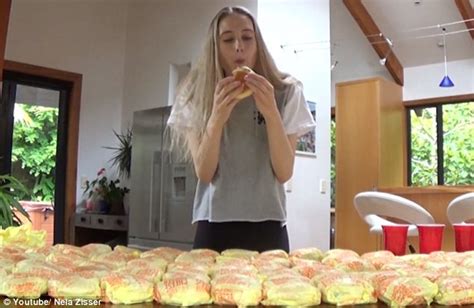 Video shows model Nela Zisser take on 100 McDonald's cheeseburger ...