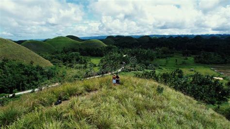 Aerial View of a Couple Walking in Chocolate Hills, Philippines Stock Video - Video of couple ...