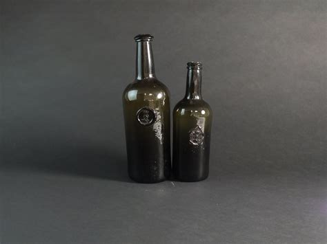 Lot 23 - Two wine bottles with the Bagot family crest