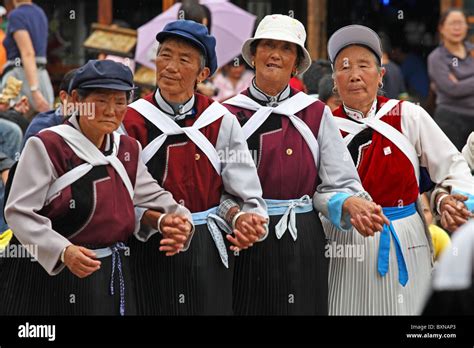 Naxi women dancing in street, Lijiang, Yunnan Province, China Stock ...