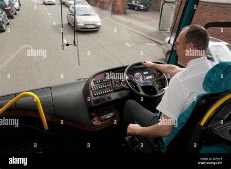 Passenger view of coach driver and road ahead Stock Photo - Alamy