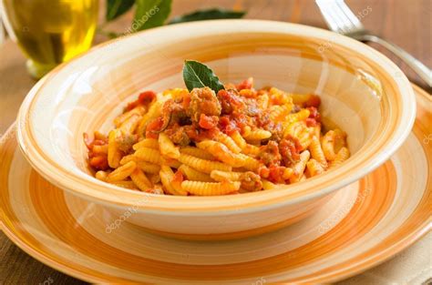 Malloreddus with sausage and tomato sauce, Sardinian Pasta — Stock Photo © marmo81 #46105439