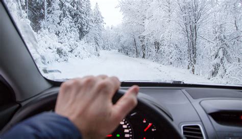 male driver, snowy road, AARP Auto, Winter Driving Tips,