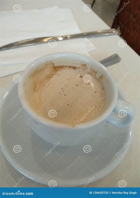 Cappucino in a white cup stock photo. Image of coffee - 126659720