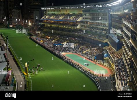 Crossing the finish line at a night race at the Happy Valley Stock Photo: 61212546 - Alamy