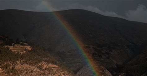 Rainbow over Town by Mountain · Free Stock Photo