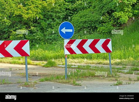 Warning and directional traffic signs on a rural road Stock Photo - Alamy