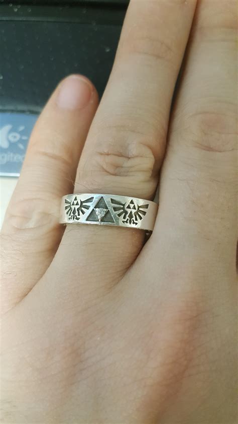 Since we are posting Zelda rings here is my wedding band. It has an incrition on the inside that ...