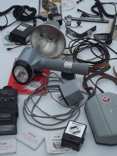 Huge lot of vintage camera flashes and camera flash accessories for parts