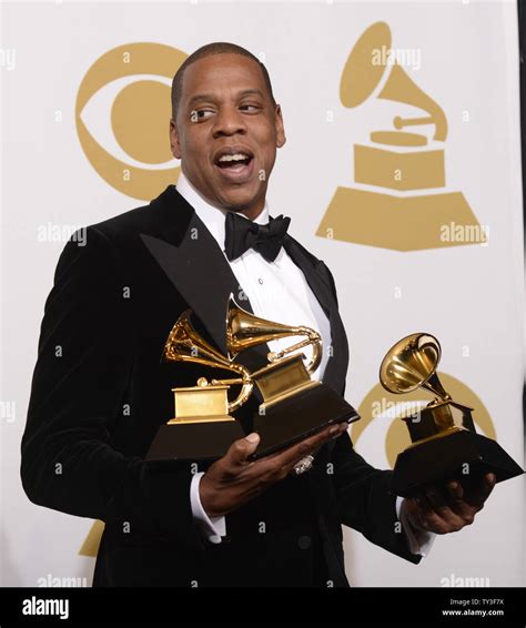 Jay-Z appears backstage with the Grammys he won at the 55th Grammy Awards at the Staples Center ...