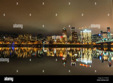 Downtown Portland Skyline At Night with cloudy skies Stock Photo - Alamy