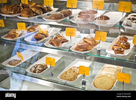 Pastries for sale in bakery display case Stock Photo - Alamy