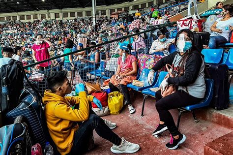 LOOK: Stranded individuals cram inside Rizal Memorial Sports Complex ...