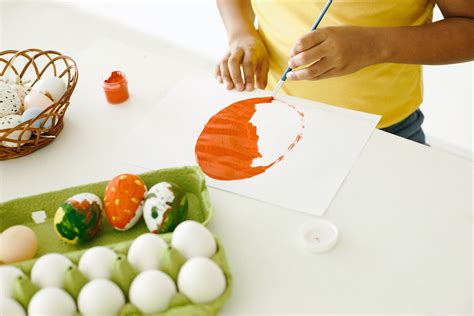 Person Painting Orange Paint on White Paint · Free Stock Photo