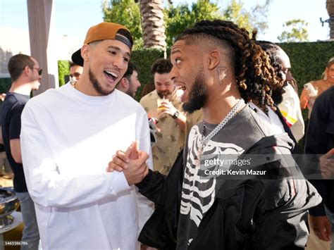 Devin Booker and Damar Hamlin attend Michael Rubin's 2023 Fanatics ...