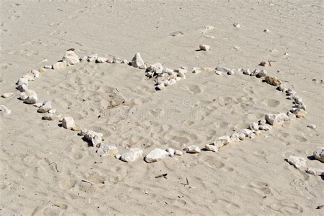 Heart drawn in the sand stock photo. Image of floor - 168221688