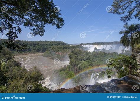 Rainbow at iguazu falls stock image. Image of travel - 298699411