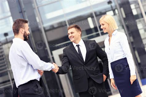 Business people greeting outside modern building 15852132 Stock Photo ...