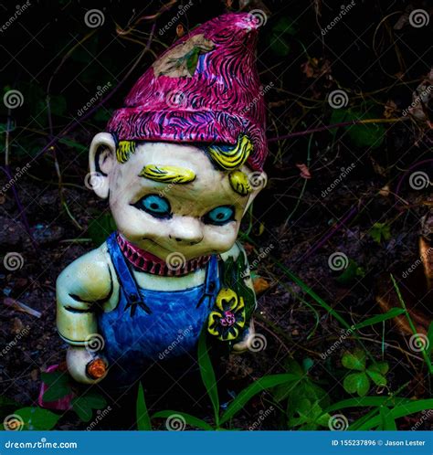 Creepy Garden Gnome with Blonde Hair and Blue Eyes Stock Photo - Image ...