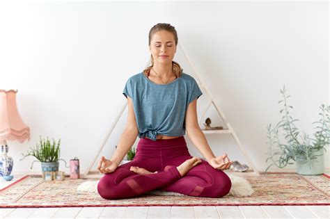 woman meditating in lotus pose at yoga studio – RALPH SMART – INFINITE ...