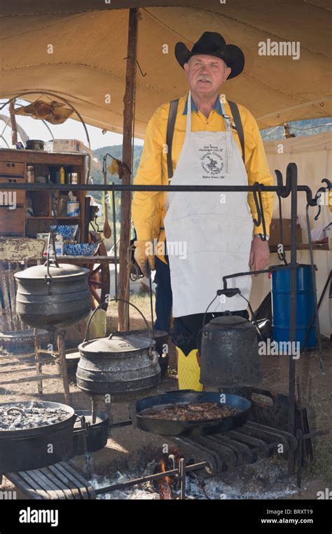 Chuck wagon cook tends the campfire, at the Lincoln County Cowboy Stock ...