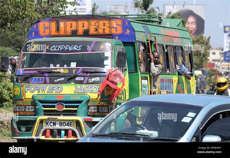 KENYA, Nairobi, Graffiti street art and traffic, colorful painted SACCO mini bus Matatu / KENIA ...