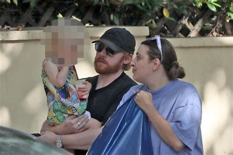 Rupert Grint scoops up daughter Wednesday, 3, and carries her to toy shop | Metro News