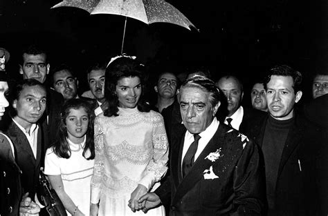 Jackie O holds onto her daughter, Caroline Kennedy, as the newlywed ...