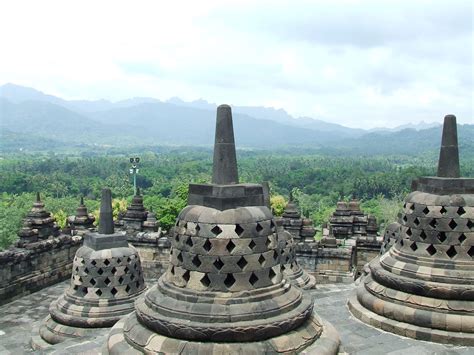 Borobudur stupas overlooking a mountain. For centuries, it was deserted ...