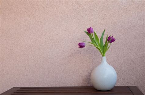 Premium Photo | Bouquet of purple tulips on background wall