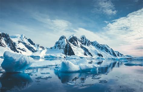 Premium Photo | Blue ice covered mountains in south polar ocean winter ...