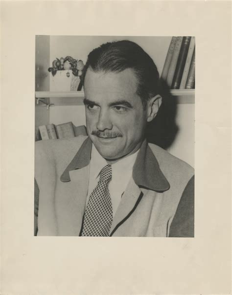 Portrait Photograph of Hughes at His Desk | LiveAuctionTalk