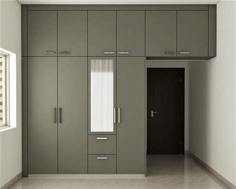 Hinged Modern Wardrobe Design Idea with Loft and Mirror | Livspace