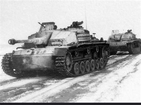 Two StuH 42 infantry support guns operating in winter conditions ...