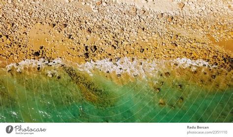 Aerial View From Flying Drone Of Ocean Waves On Beach - a Royalty Free Stock Photo from Photocase