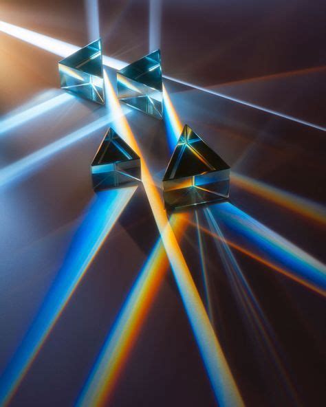 The white light shining into the prisms is being redistributed showing it's colors individually ...