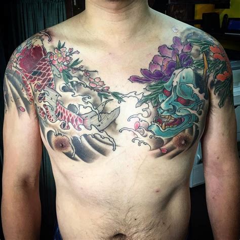 Neo Japanese style chest and shoulder tattoos.