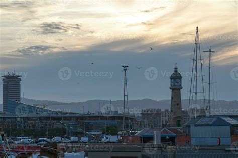 Port Vell and the Barceloneta Clock Tower at sunset 24038368 Stock ...